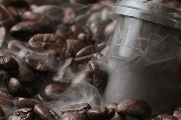Coffee beans with a coffee filter on top